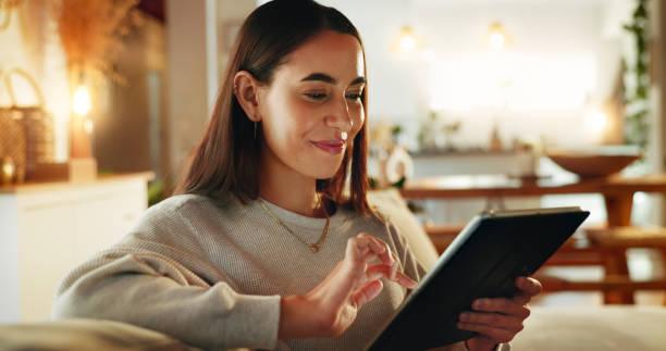 Shopper joining a live auction from her tablet at home